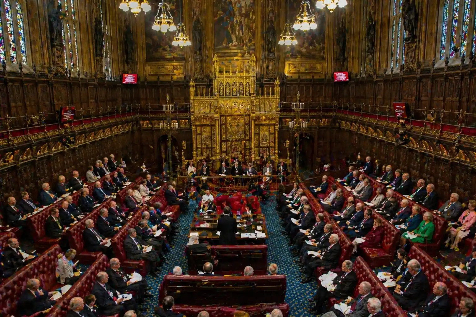 The ornate red-benched House of Lords chamber in the Palace of Westminster.